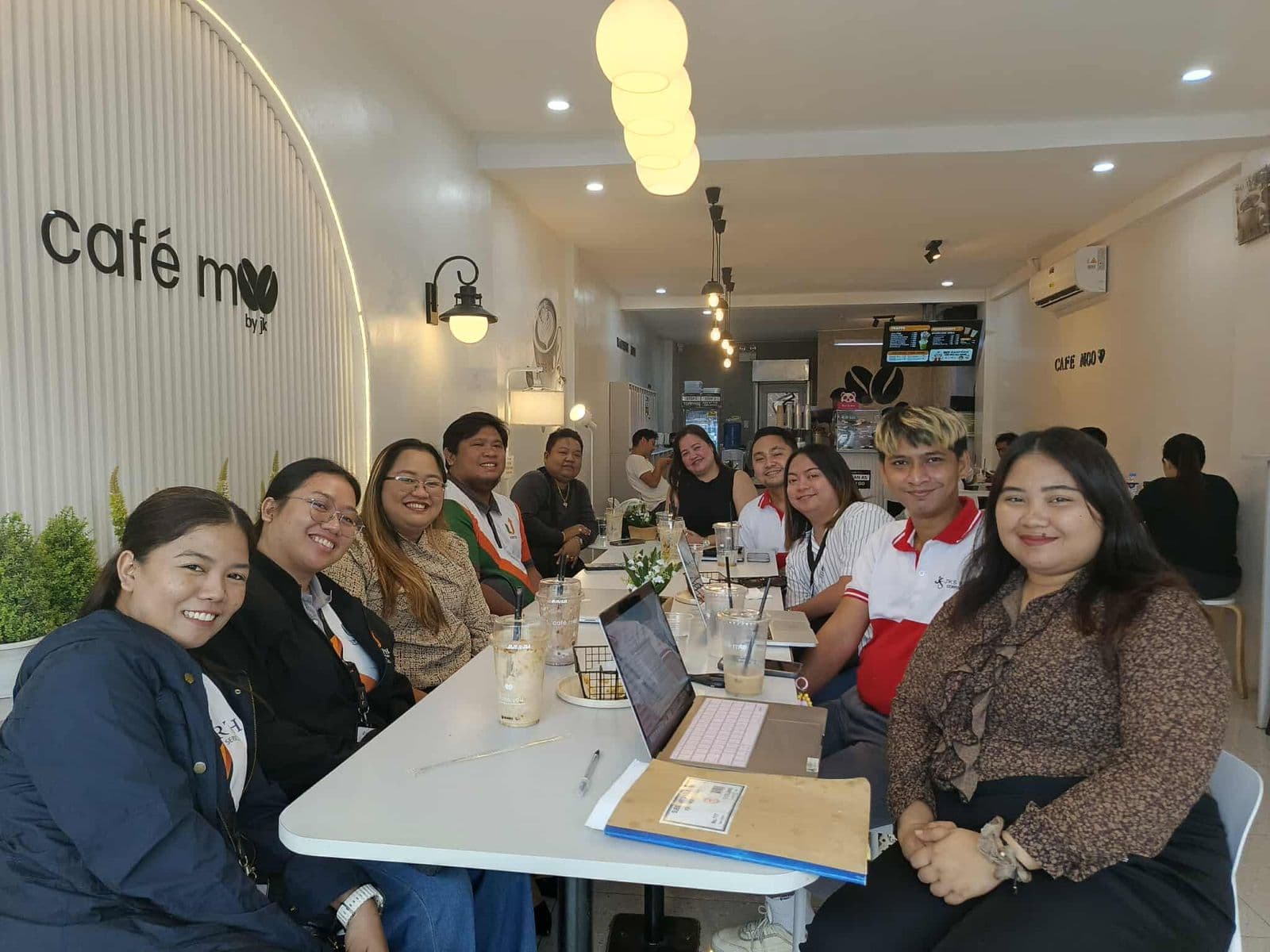 UPworth team meeting a client at Cafe M