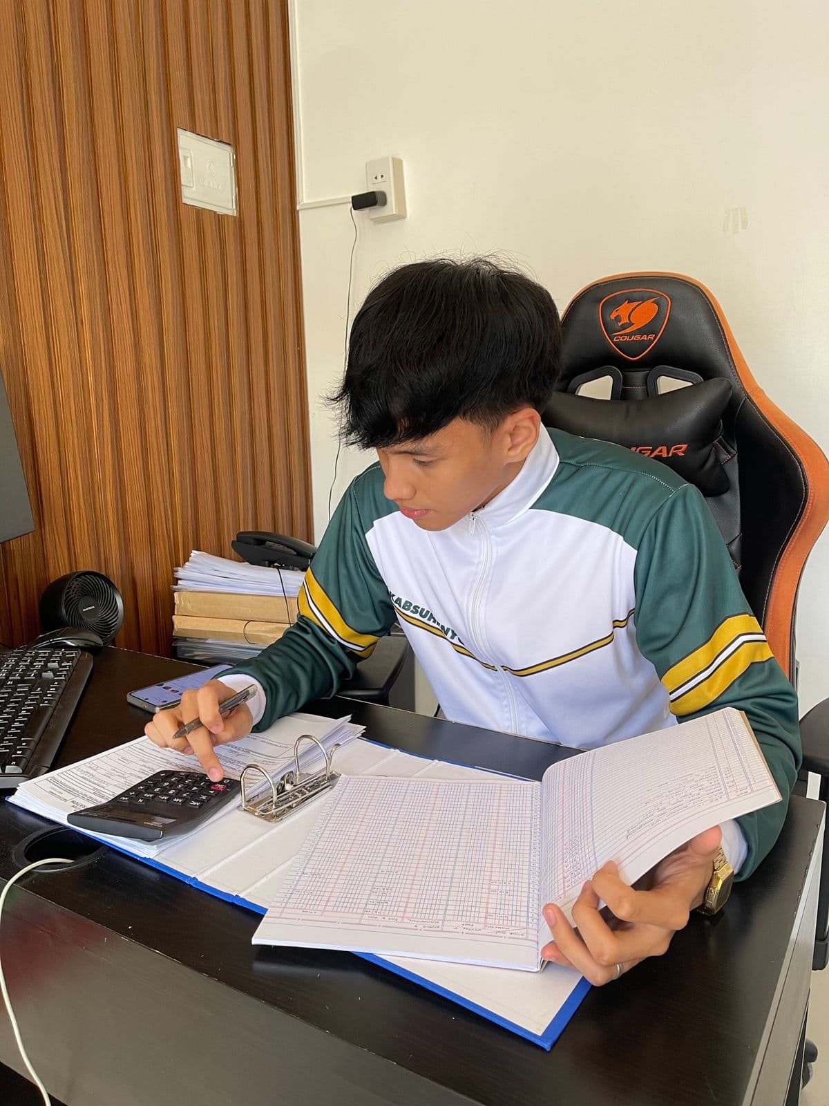 A UPworth intern preparing financial records